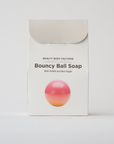 pink body soap in the shape of a ball in a box