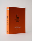 orange book with the letter L on the front