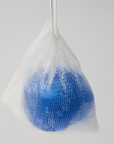 a blue ball of body soap inside a mesh bag