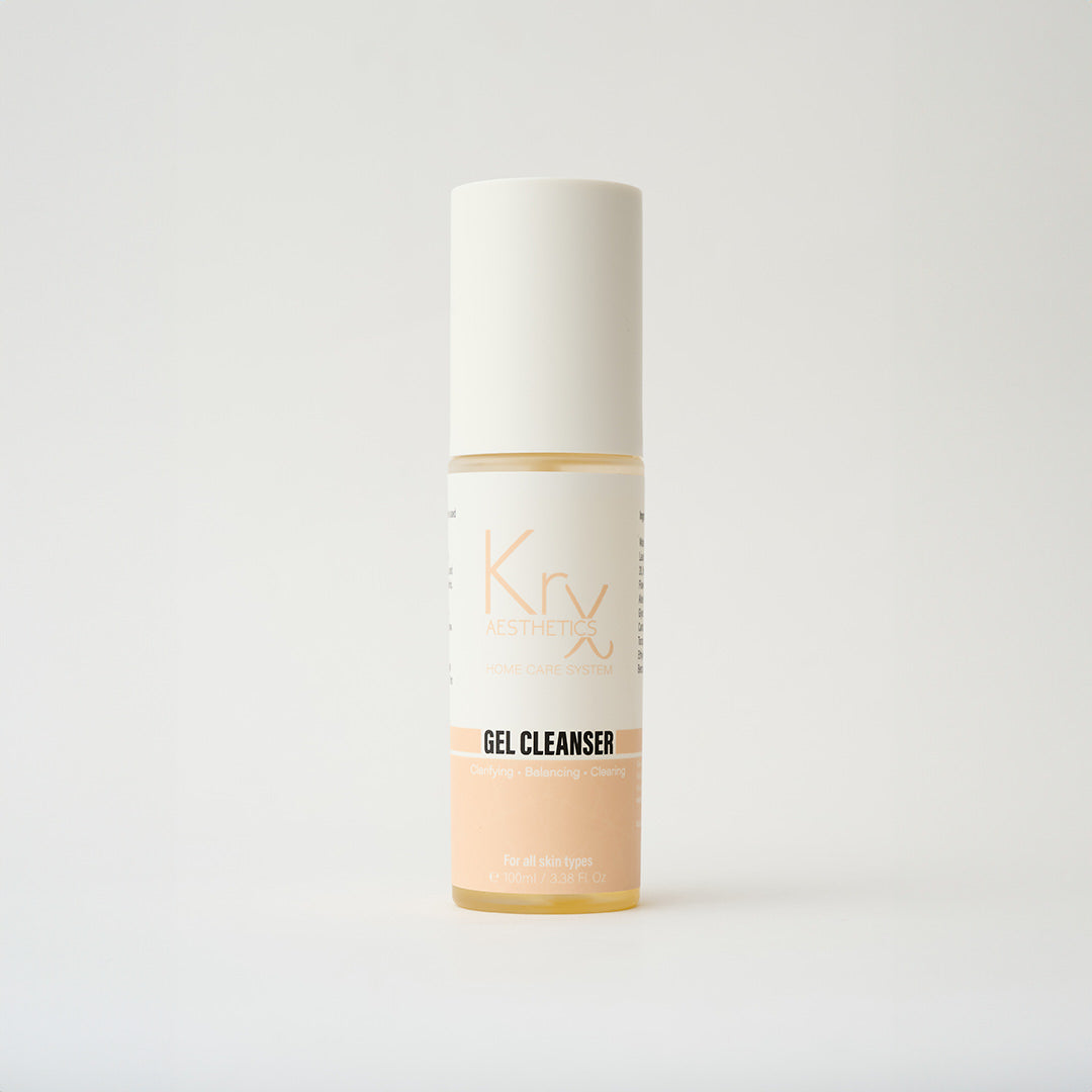 face cleanser in a clear bottle with peach colored label