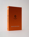 orange book with the letter g on the front
