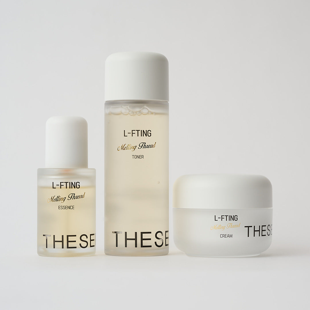 3 skincare products lined up next to each other in clear packaging and white caps