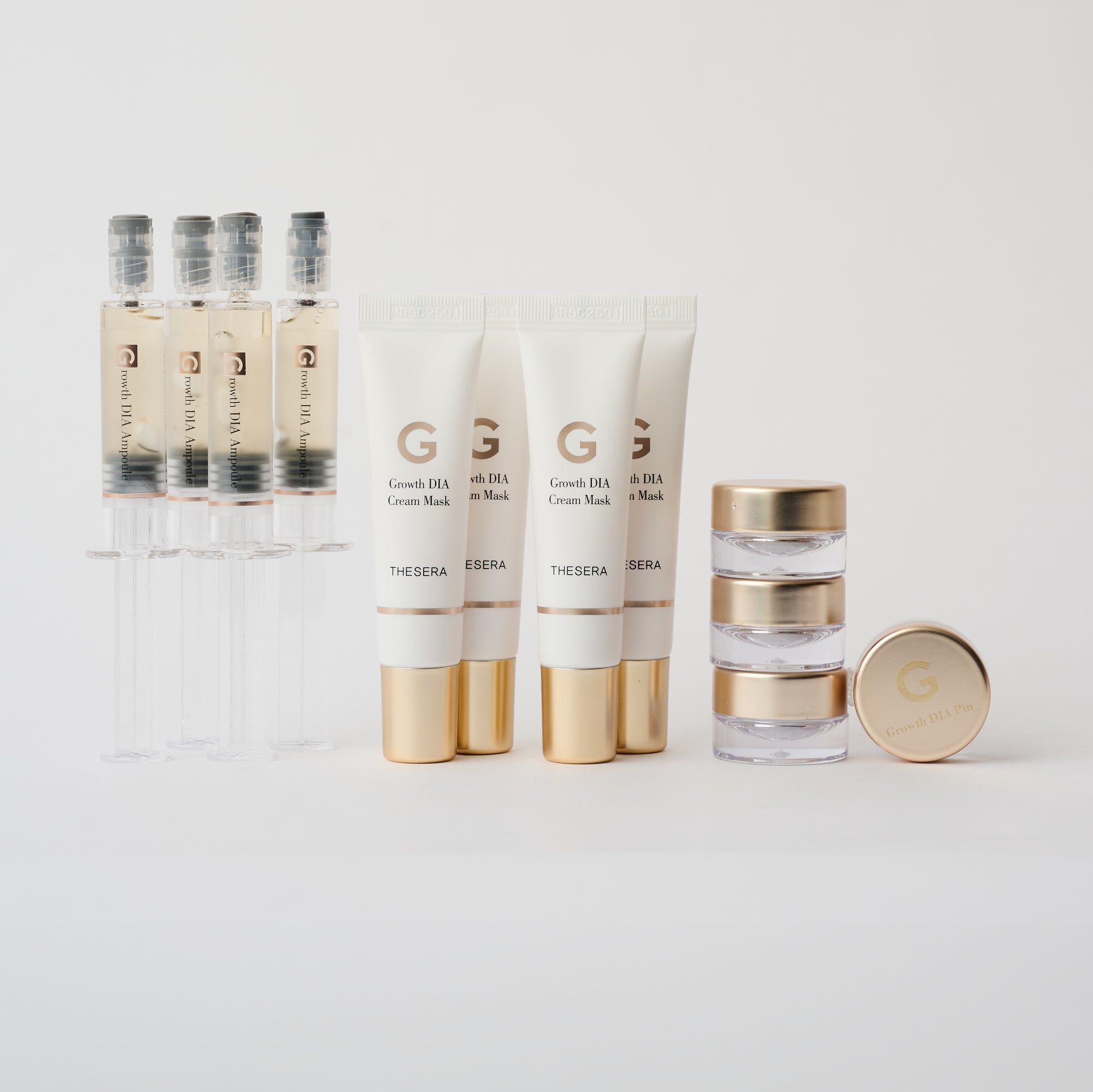 multiple skincare items next to each other in gold and white packaging