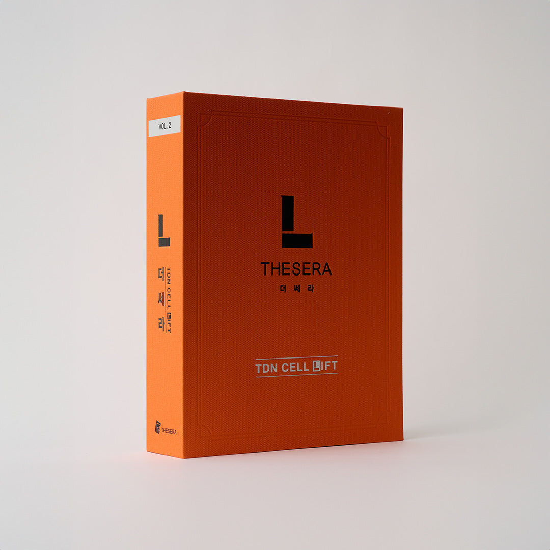 orange book with the letter L on the front